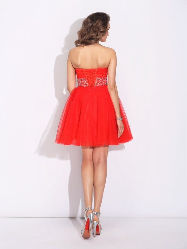 A-Line/Princess Sweetheart Rhinestone Sleeveless Short Net Dresses Homecoming Dresses Lia